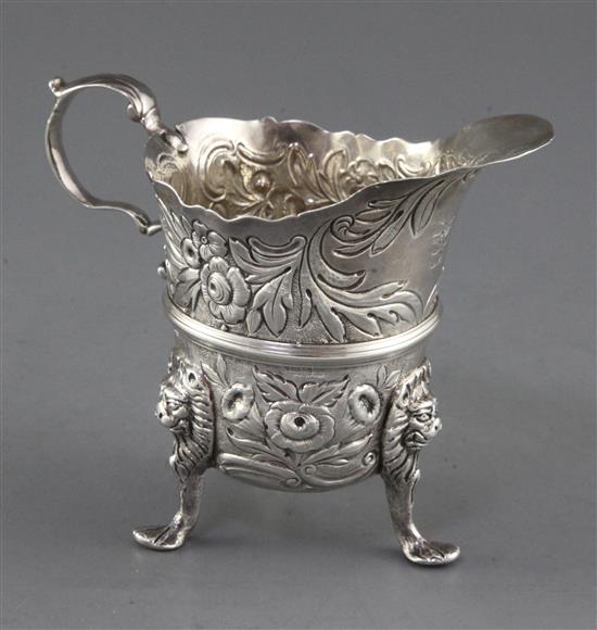 A mid 18th century Irish silver tripod milk jug, by William Townsend? 6 0z.